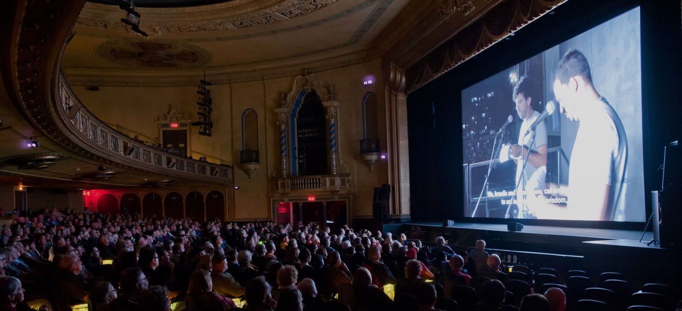 Photo of people inside the theater watching a film at Roger Ebert's Film Festival (circa 2023)